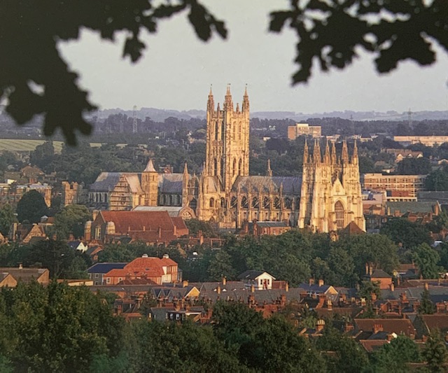 A castle with a mountain in the background
Description automatically generated