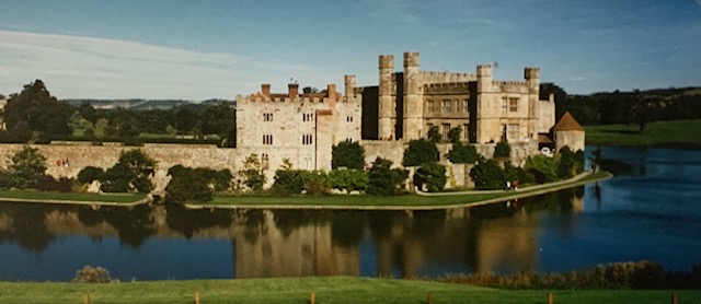 A castle surrounded by a body of water
Description automatically generated